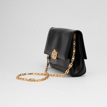 CÉLINE, a black leather evening bag.