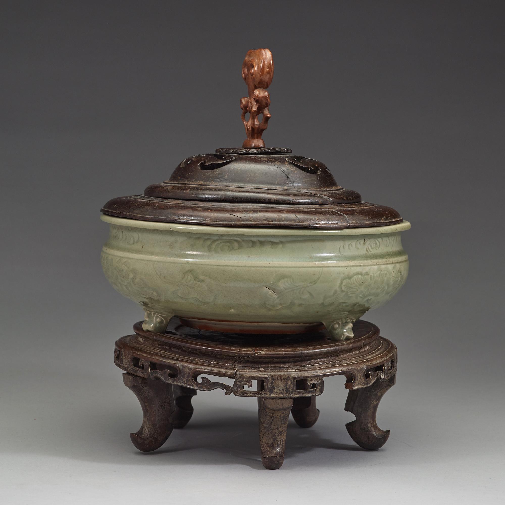 A large tripod celadon censer, presumably late Ming dynasty (1368-1644).