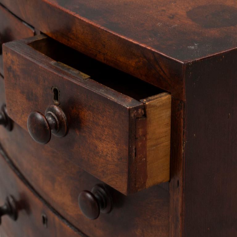 An early 19th Century Regency miniature chest of drawers.