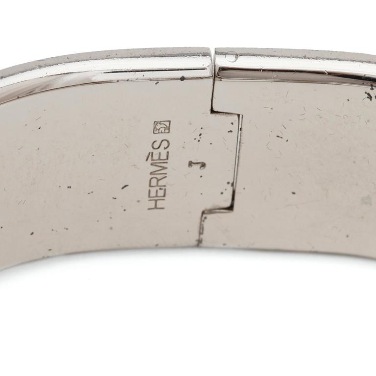 HERMÈS, a white enameled bracelet, "Clic H".