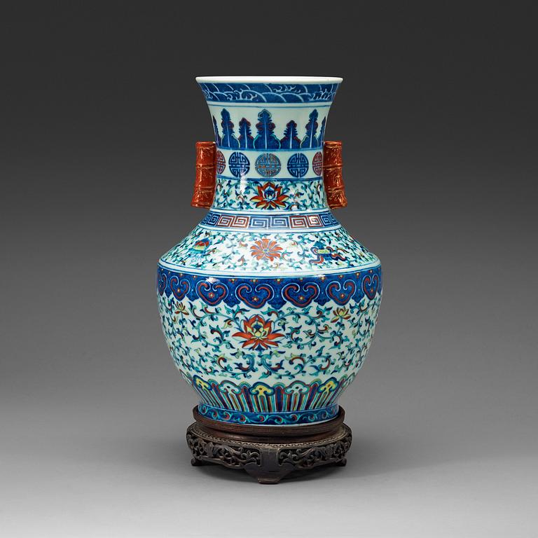 A doucai vase with bamboshaped handles, Qing dynasty, 19th Century, with Qianlong seal mark.