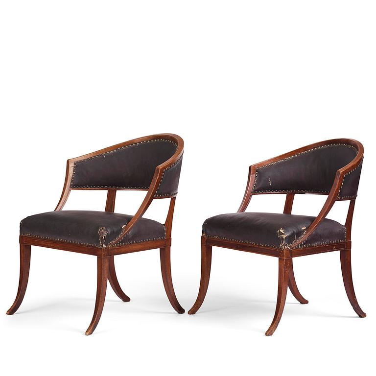 A near pair of mahogany open armchairs, one late Gustavian, Stockholm circa 1800.