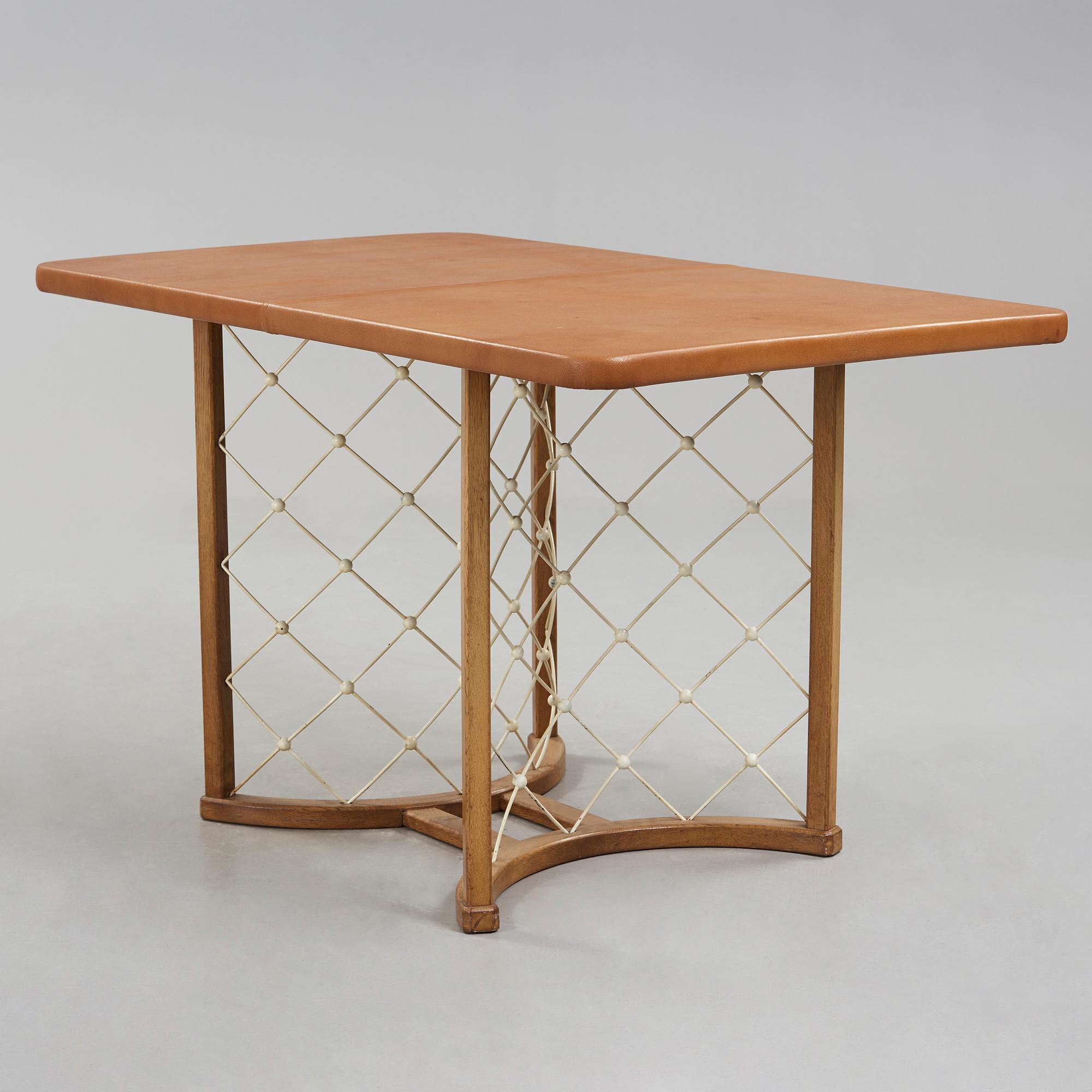 A modernist oak based table, 1940-50's.