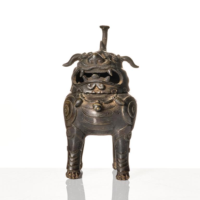 A bronze censer in the shape of a buddhist lion, Ming dynasty (1368-1644).