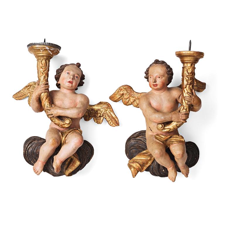 A pair of Baroque candle holders, first half of the 18th century.