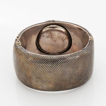 Silver bangle with watch.