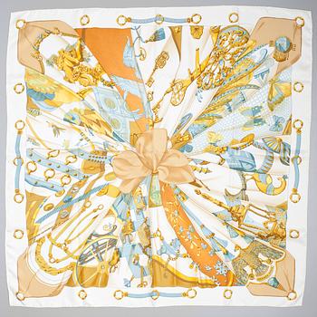 66. A Hermès silk scarf "Soleil de soie".