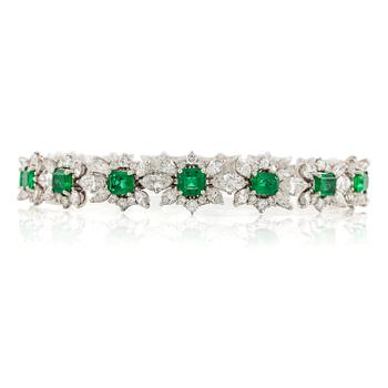 A bracelet in 18K white gold with step-cut emeralds and round and navette-shaped brilliant-cut diamonds.