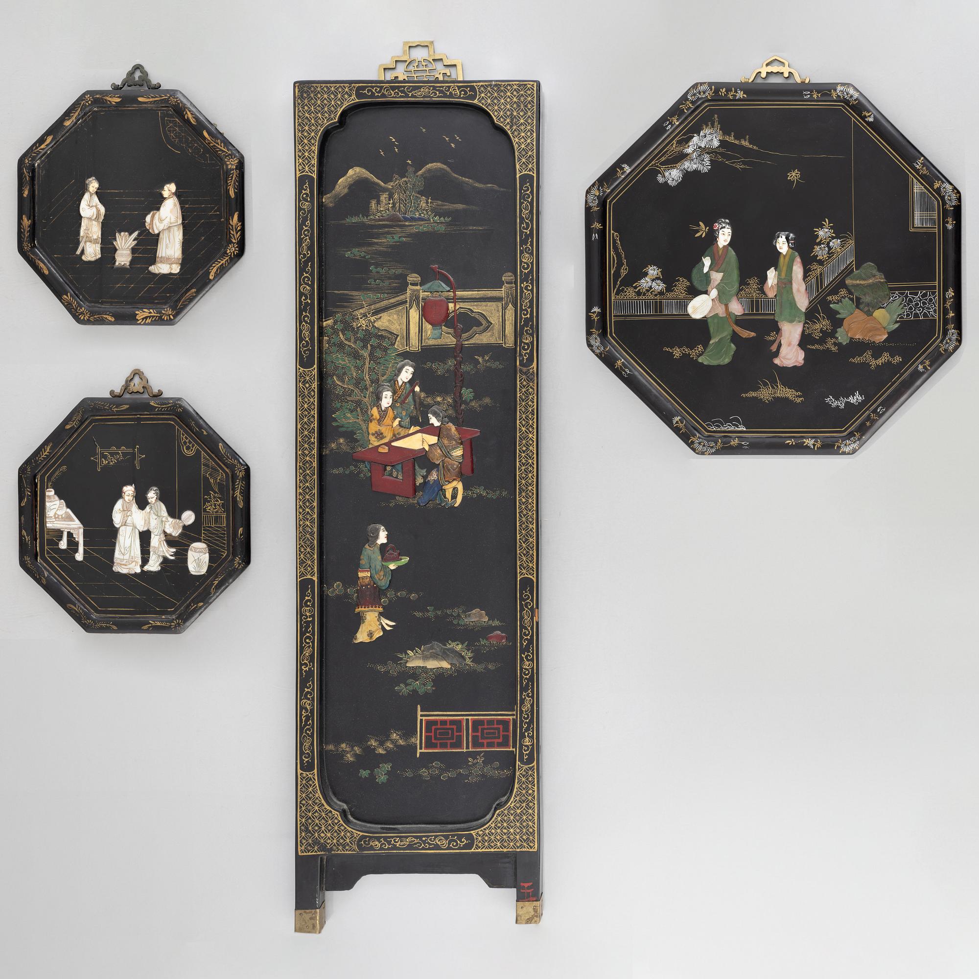 Four black-lacquered wall decorations, China, around 1900.