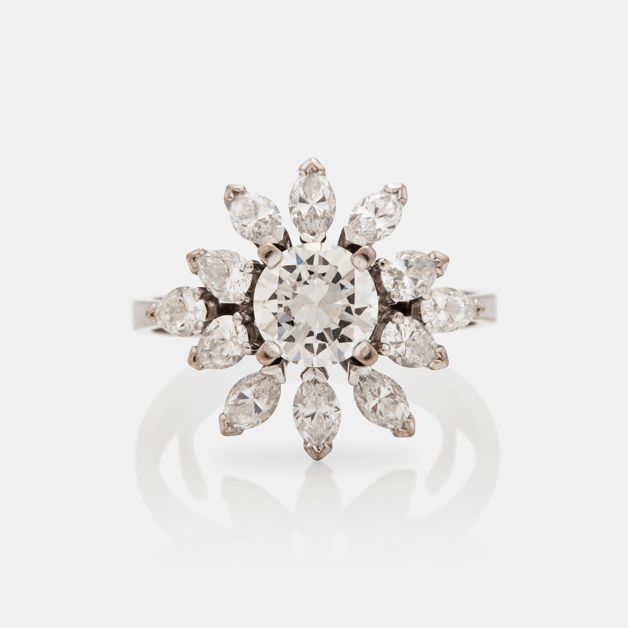 A older brilliant-, marquise-, and pear- cut diamond ring. Center diamond circa 1.20 cts.