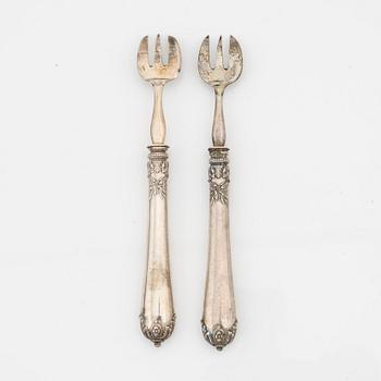 Philippe Berthier, a set of 12 silver oysterforks, mid 19th century.