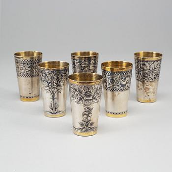 A Russian set of 6 parcel-gilt silver and niello vodka-cups, the Soviet Union/Russia, second half of the 20th century.