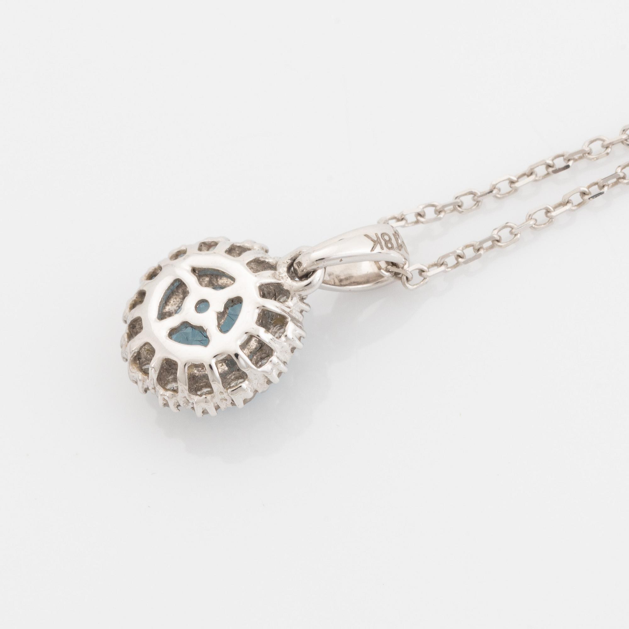 Blue topaz and brilliant cut diamond earrings and necklace.