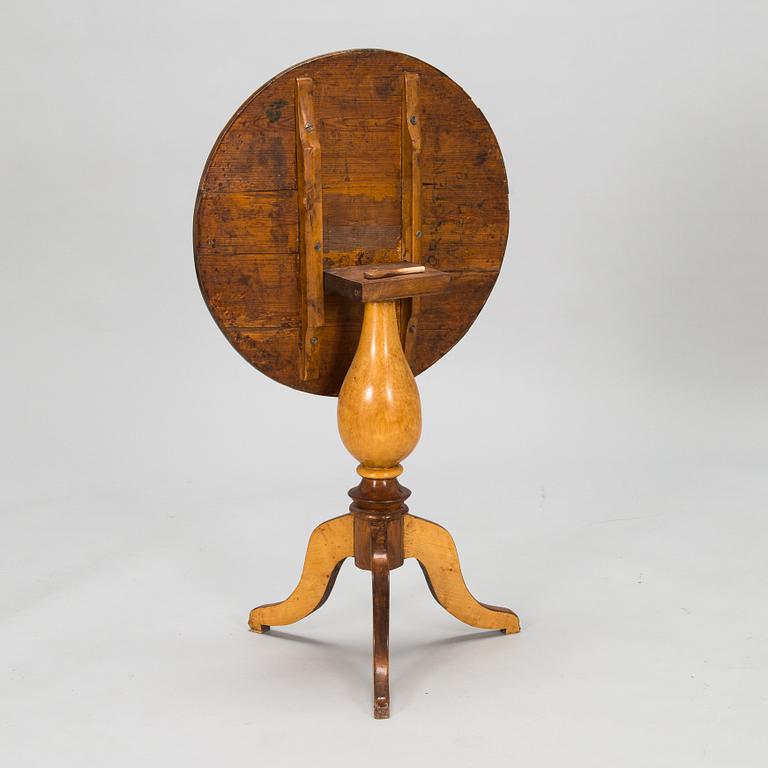 A tilt top table from 19th Century.