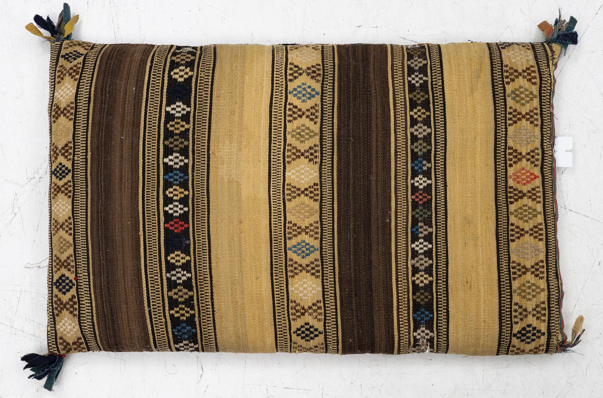 A mid-19th century carrige cushion, flat weave, c. 80 x 46 cm southwest Scania.