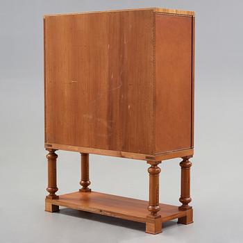 Otto Schulz, Boet, Gothenburg, probably, a cabinet covered with brown leather, dated 1942.