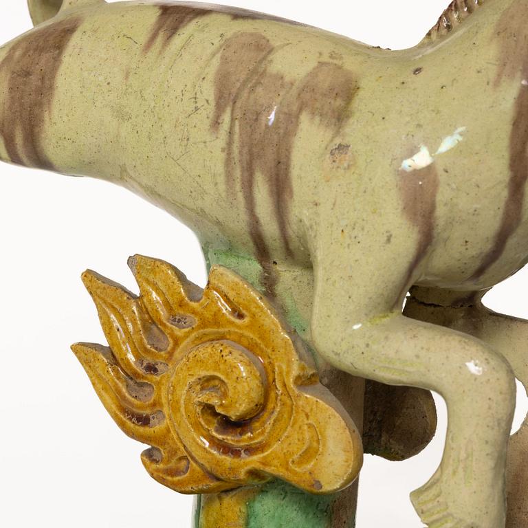 A set of two green and yellow glazed roof tiles figures of flying horses, Qing dynasty.