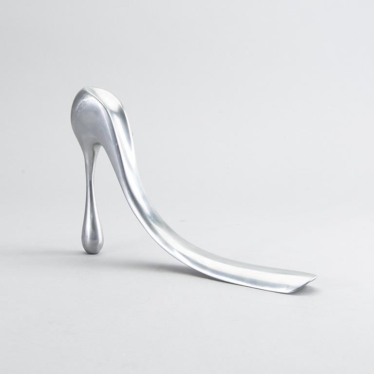 A metal shoe horn by Manolo Blahnik.