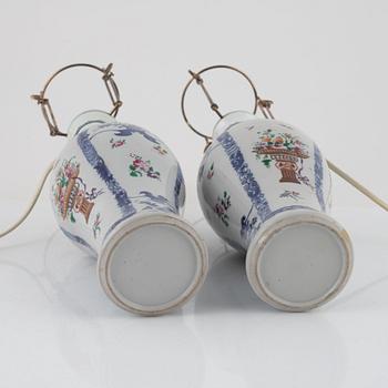 A pair of Chinese porcelain table lights/vases, 18th Century.