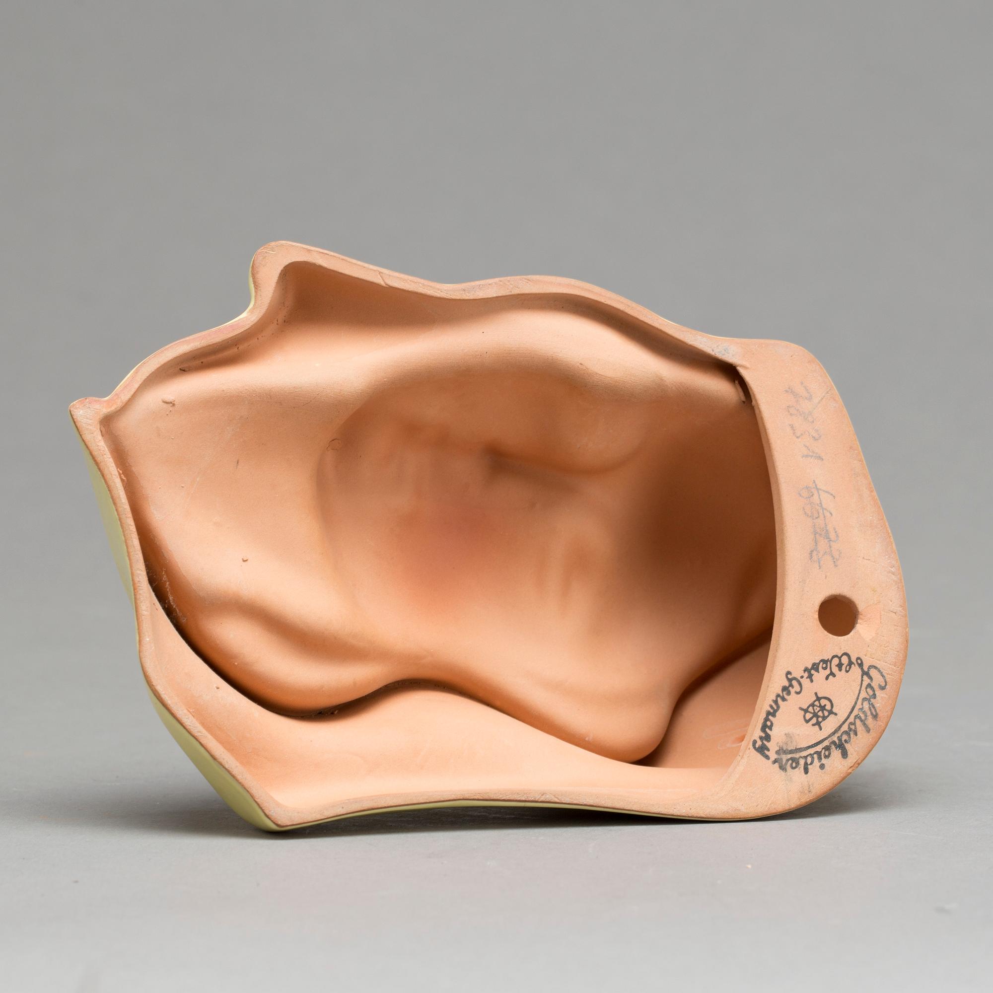 An Adolf Prischl terracotta wall mask for Goldscheider 1930'.