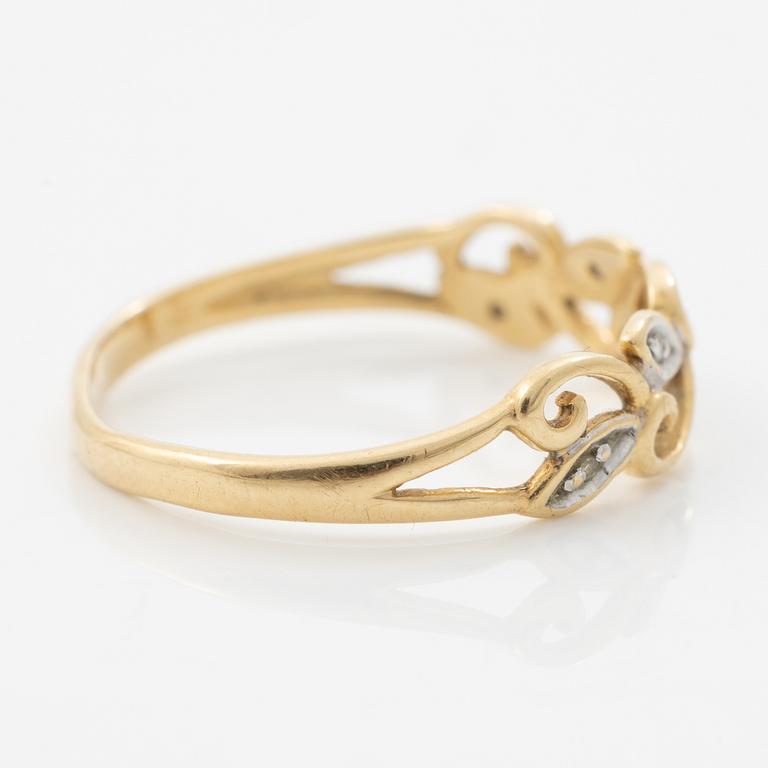 Ring, 18K guld med genombruten dekor med små diamanter.
