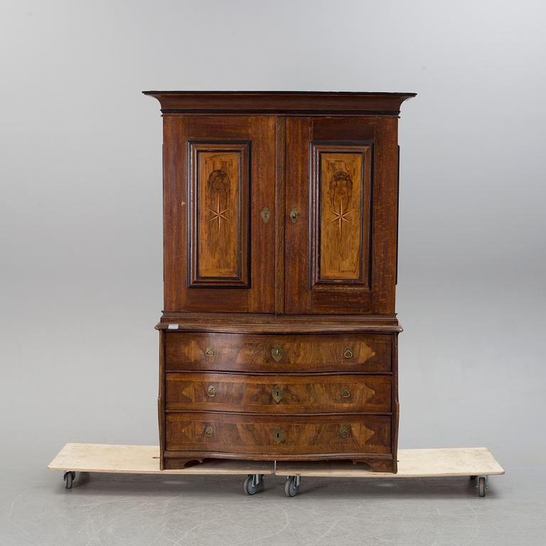 An 18th century oak and walnut cabinet.