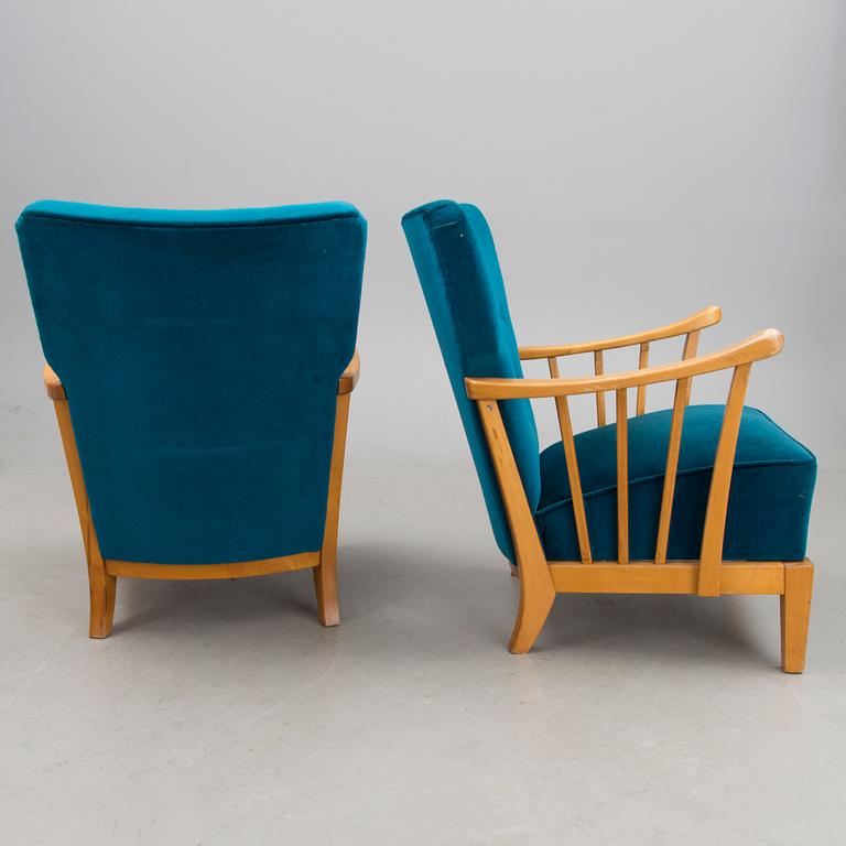 A pair of mid 20th century '2402 Armi' armchairs by Ilmari Lappalainen/Olavi Lieto, Asko, Finland.