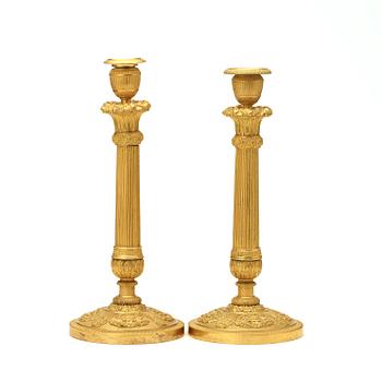 A pair of Empire early 19th century candlesticks.