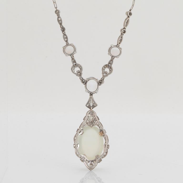 A platinum necklace set with moonstones and old- and eight-cut diamonds.