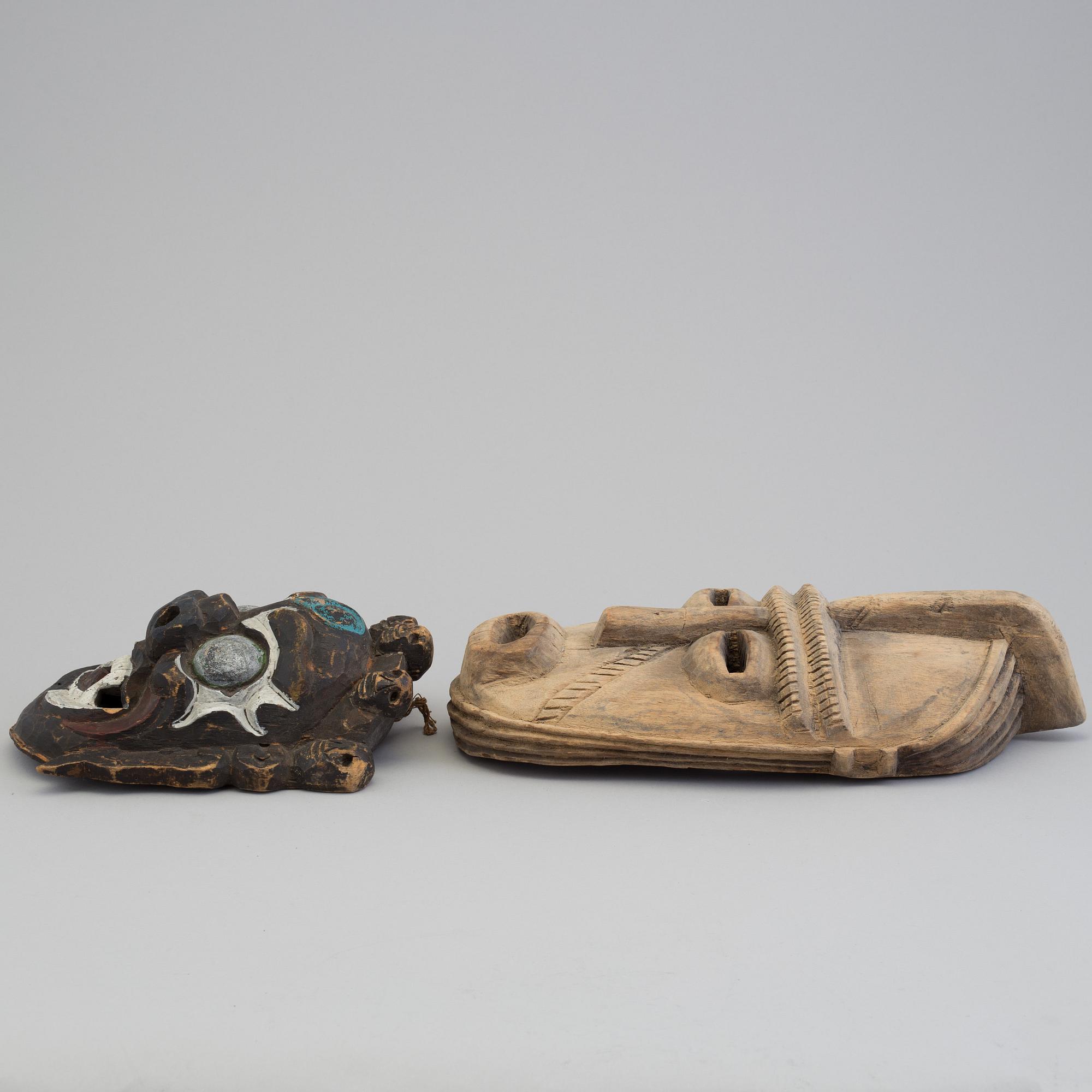 2 asian masks, 20th century.