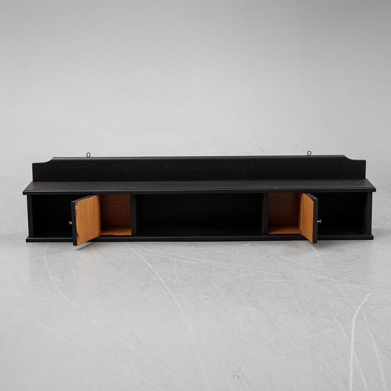 A painted wall shelf, early 20th Century.