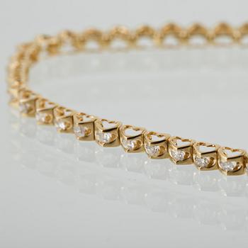 ARMBAND, 18K guld med briljantslipade diamanter. Vikt 4,7 gram.