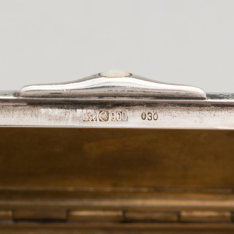 Three silver cigarette cases and a silver pillbox, marked in Finland and Germany, first half of the 20th Century.