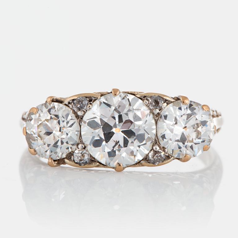 An 18K gold three stone ring with old-cut diamonds with a total weight of ca 3 cts.