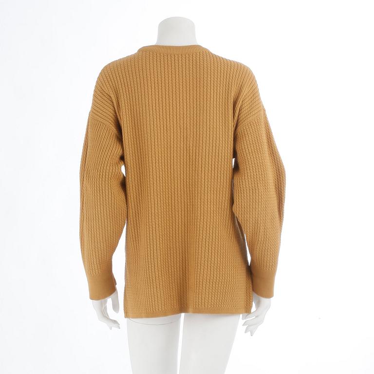 YVES SAINT LAURENT, a yellow mustard sweater, from the 1980s.