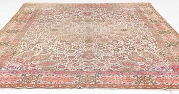 A Tabriz carpet, c. 390 x 305 cm.