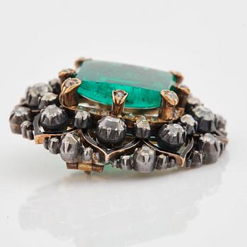 An emerald, black enamel and old cut diamond brooch. 19th century.
