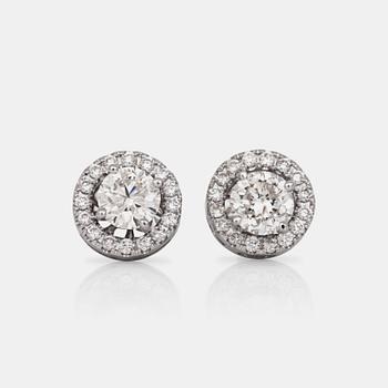 A pair of brilliant-cut diamond earrings. Center diamonds circa 0.70 cts/each.