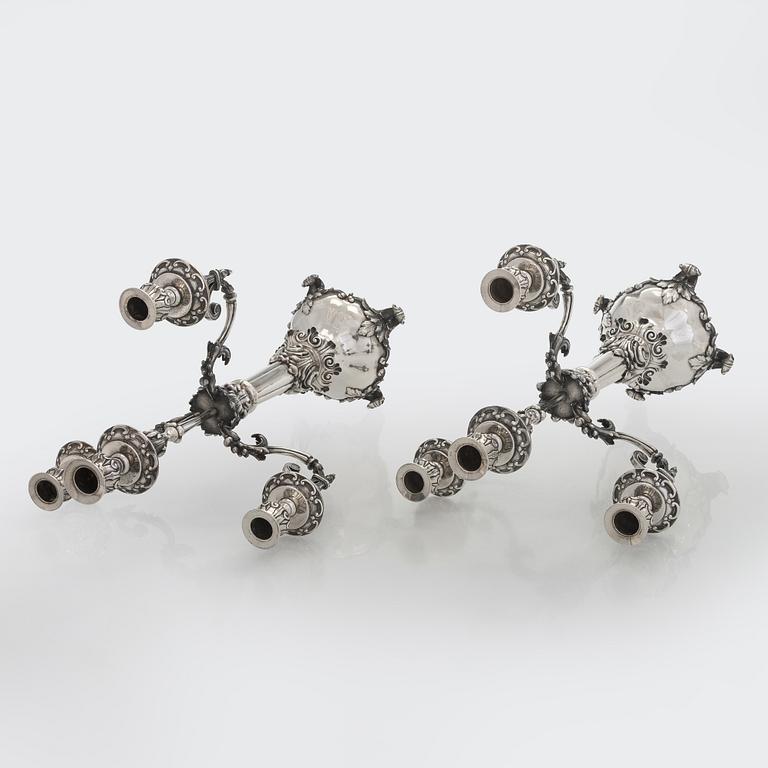 A pair of silver candelabra, maker marks of Carl Johan Tegelsten, Saint Petersburg 1850.