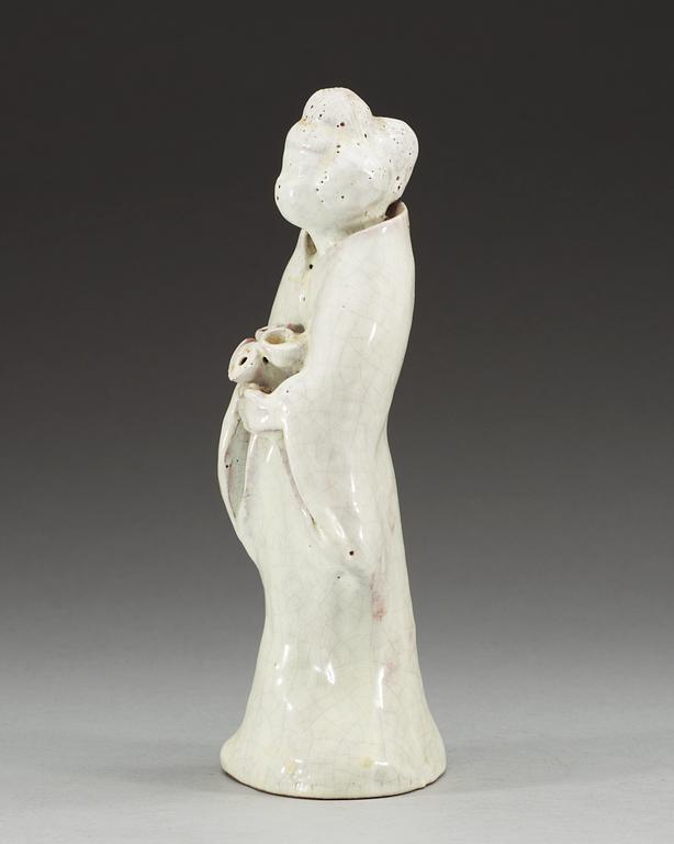 A white ge-glazed figure of a lady with flowers, presumably Japanese.