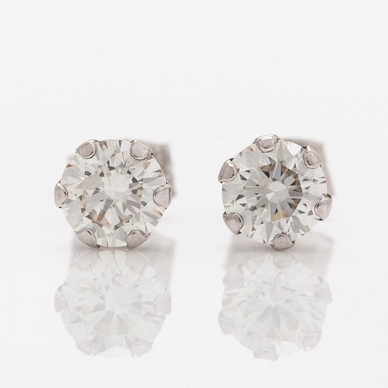 A pair of 14K white gold earrings, set with brilliant-cut diamonds. With IGI certificate.