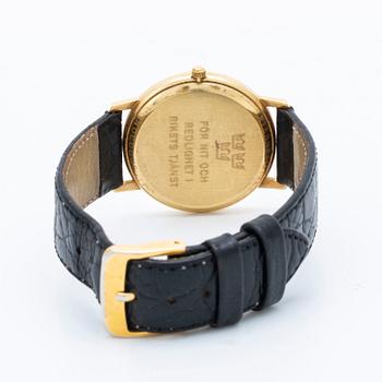 A Tissot 14 ct gold wrist watch 34 mm.