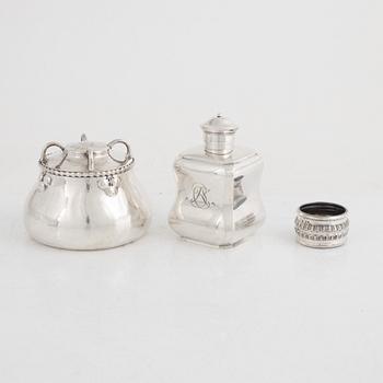 A silver tea caddy, a sugarbowl and a napkin ring, including K. Anderson, Stockholm 1920.