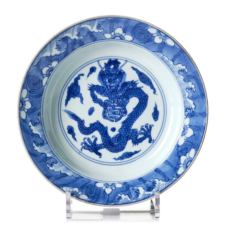 A blue and white 'dragon' dish, Qing dynasty with Yongzheng mark and of the period (1723-35).