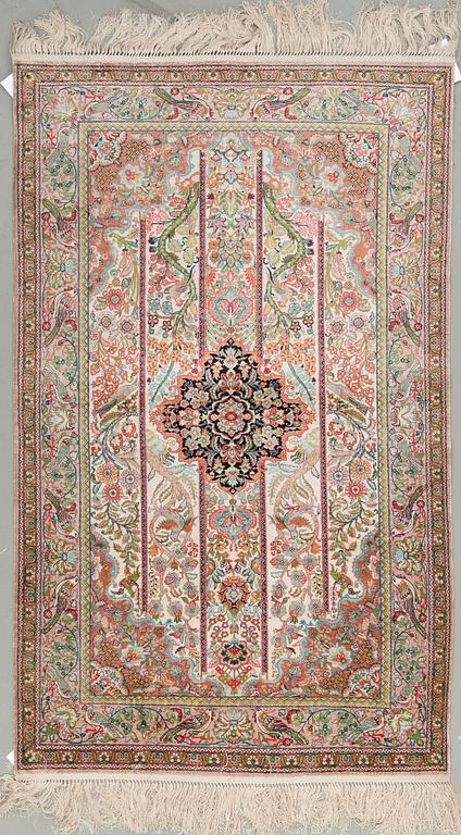 A chinese silk rug, around 153 x 94 cm.