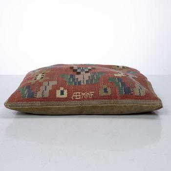 Märta Måås-Fjetterström, a cushion, 'Blommor på röd botten', signed AB MMF, ca. 31 x 31 cm.