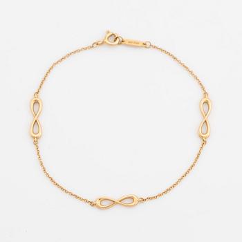 Tiffany & Co, an 'Infinity Endless' 18K bracelet.