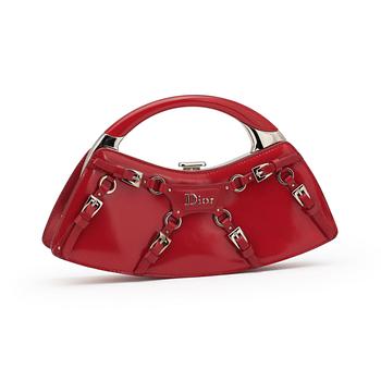 561. CHRISTIAN DIOR, a red patent leather handbag.
