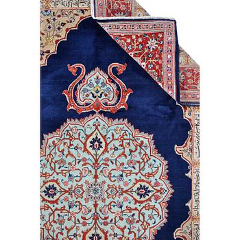 A carpet, Tabriz signed Nematzadeh, ca 291 x 176 cm.