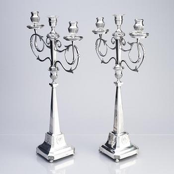 A pair of Swedish silver candelabras, marks of Pehr Zethelius, Stockholm 1797 and Daniel Hedberg, Eksjö 1829.